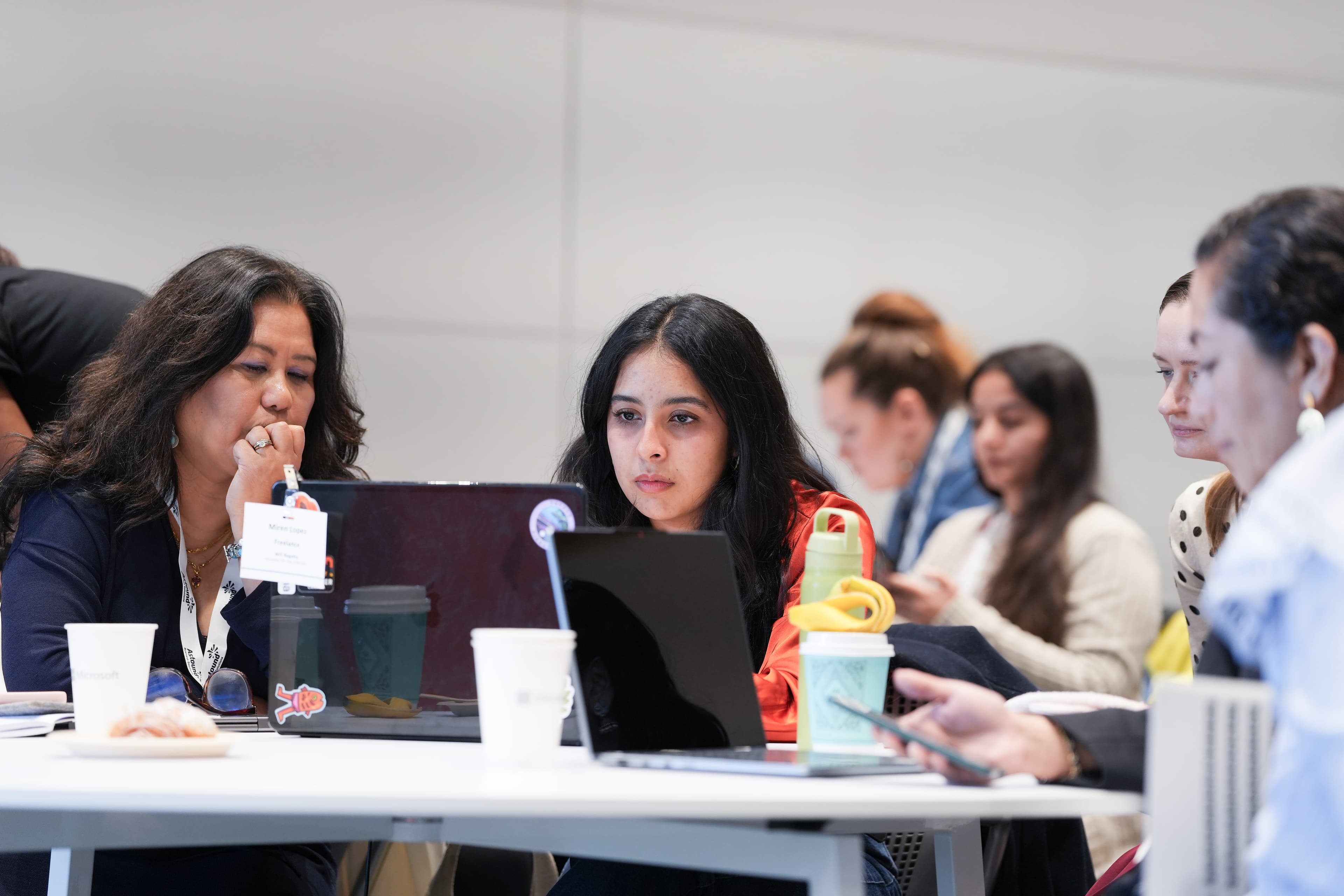 Professionals learning to apply AI tools during an interactive training session